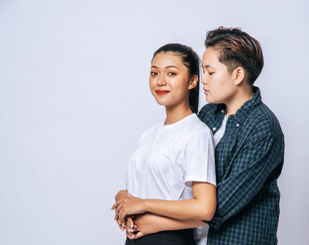 two female lovers standing and hugging from behind- call girls in indore