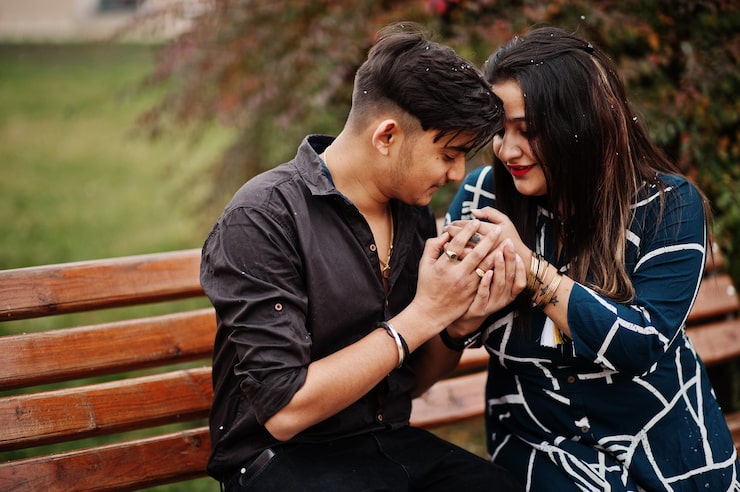 love story indian couple posed outdoor sitting bench together 627829 13661